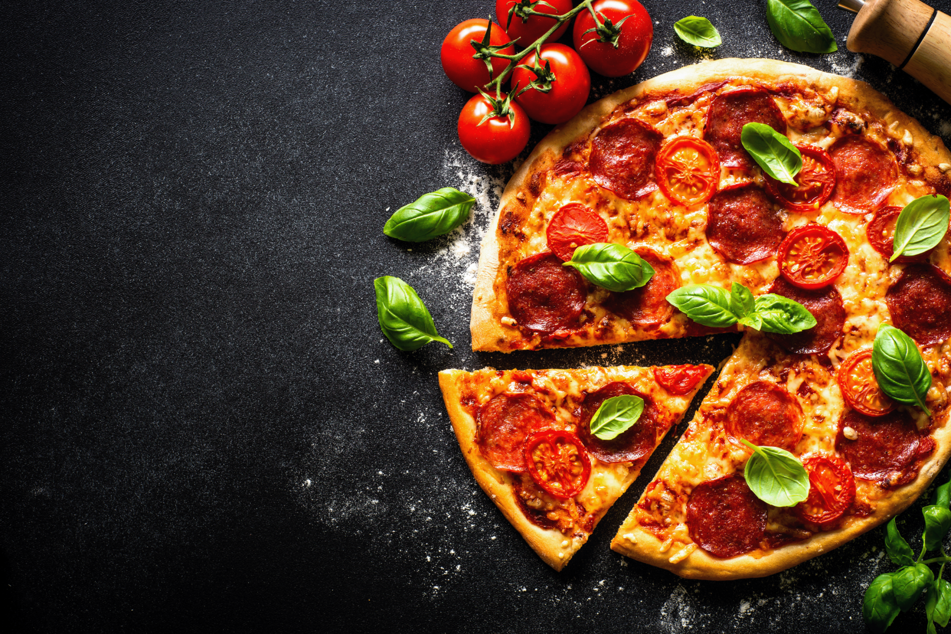 pizza with salami at black background 2026 01 08 05 04 07 utc - National Pizza Day: Why Premium & Provenance Matters to UK Consumers